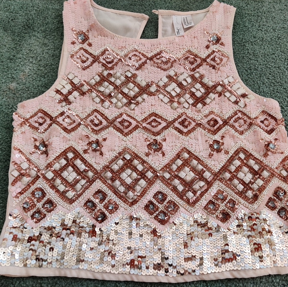 Cute, very detailed top. never worn